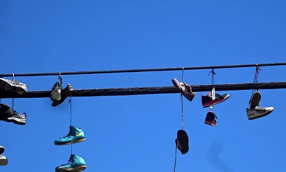 why-do-people-throw-shoes-over-power-lines-the-shoe-buddy