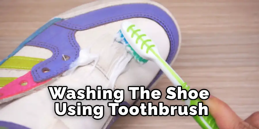 Washing The Shoe Using Toothbrush