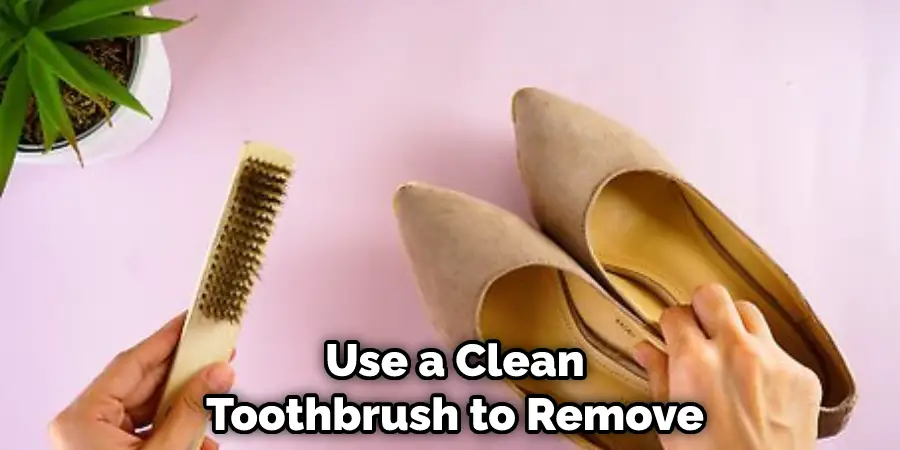 Use a Clean Toothbrush to Remove