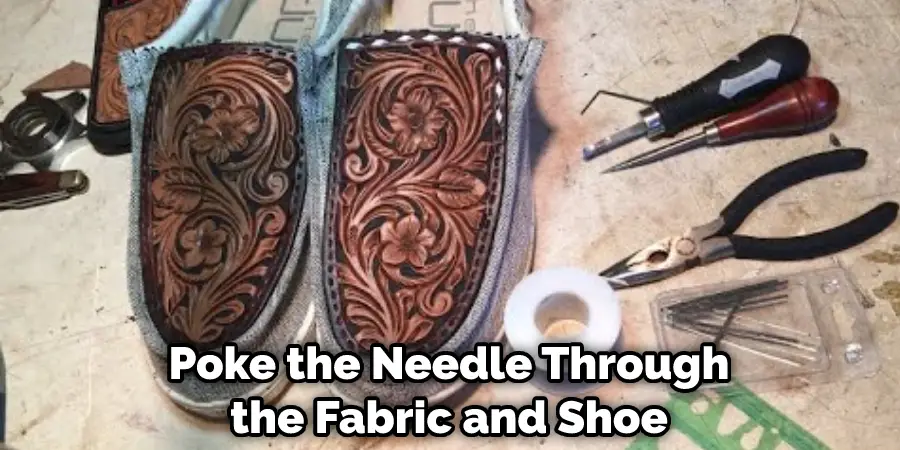 Poke the Needle Through the Fabric and Shoe